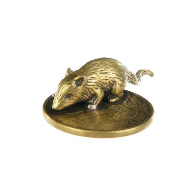 Mouse amulet in wallet with a coin for good luck in financial matters
